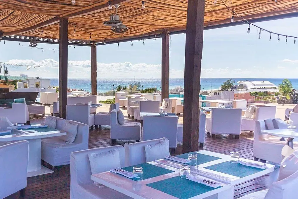 The Fives Corpo: Dine at this chic open-air restaurant with ocean views.