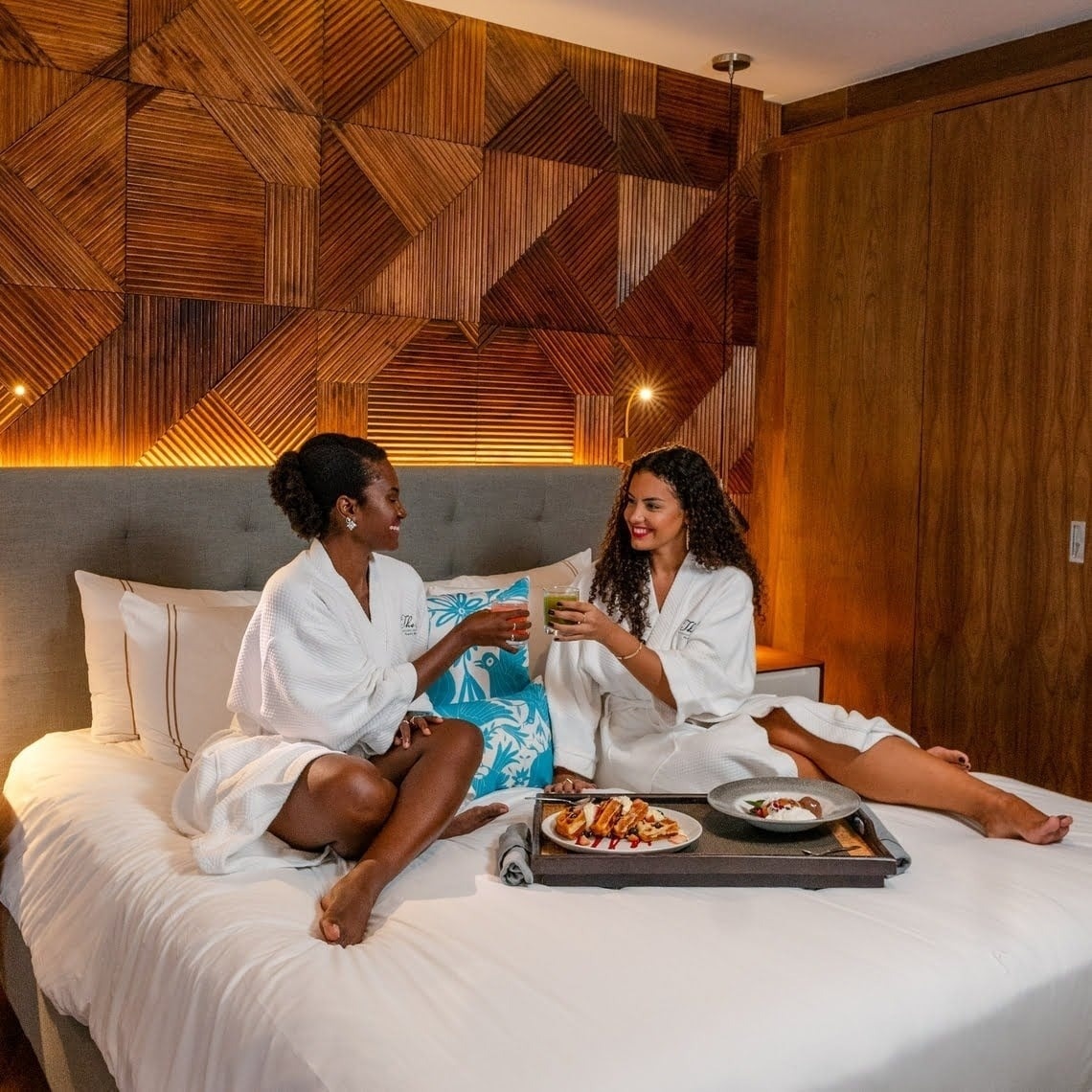 a plate of food is on a table in front of a purple wall