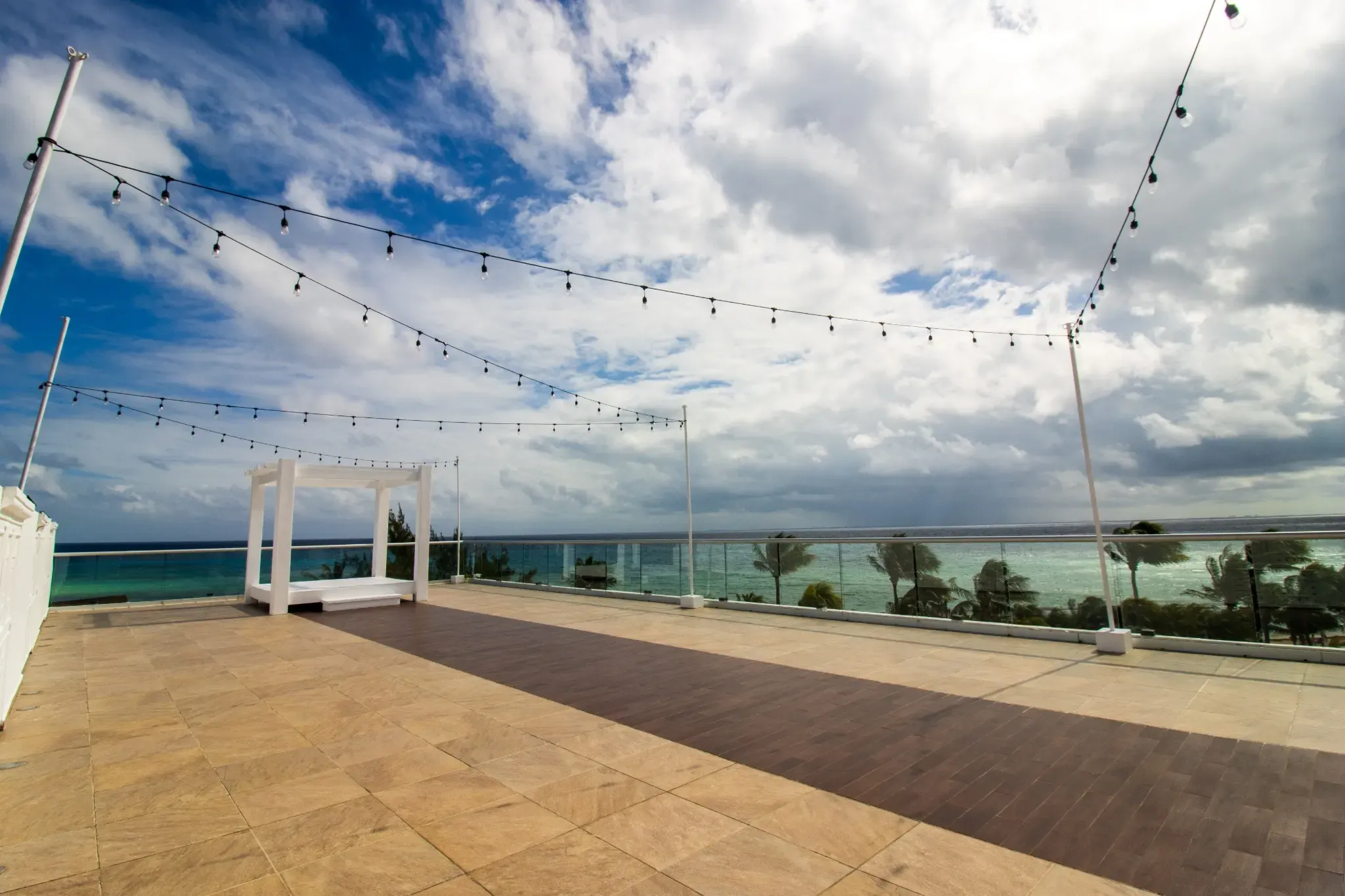 Rooftop wedding venue The Fives Corpo with ocean views and string lights