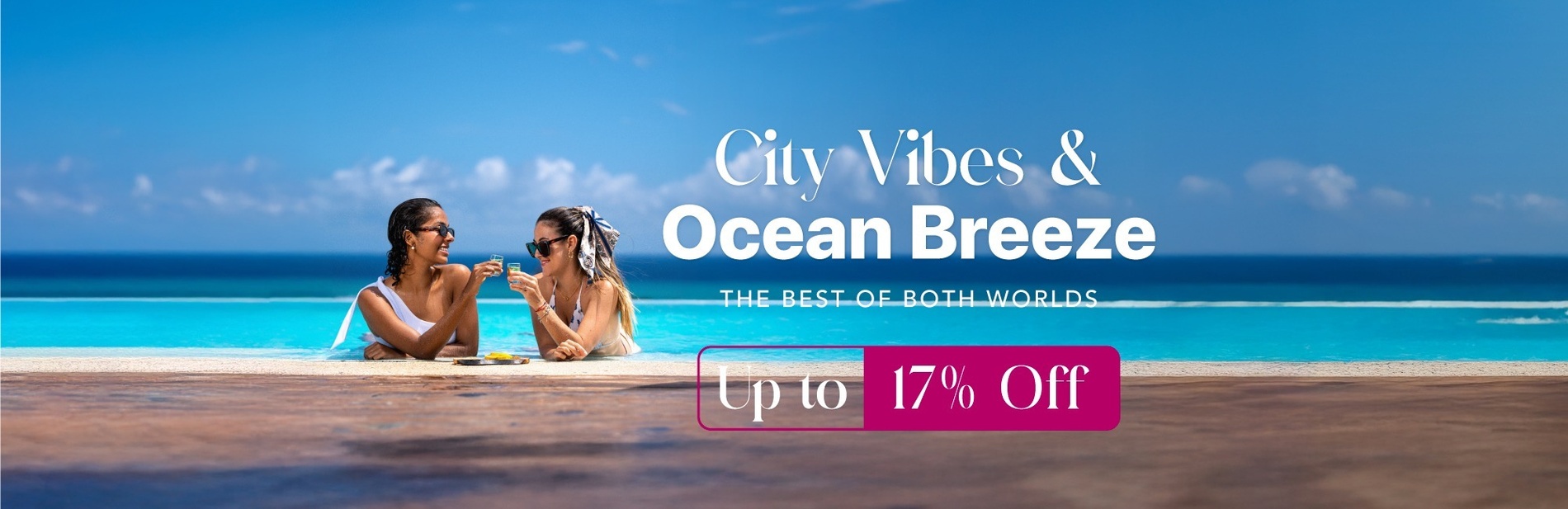 a man and woman standing on a balcony overlooking a swimming pool