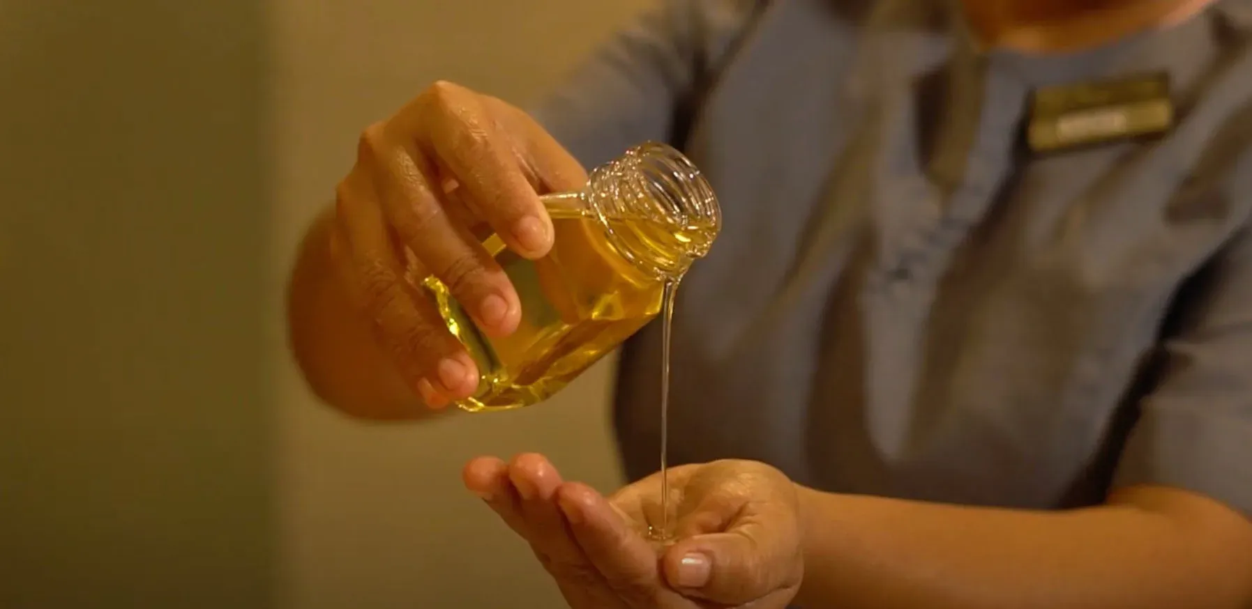 Oil poured into hand, a spa amenity from The Fives Corpo.