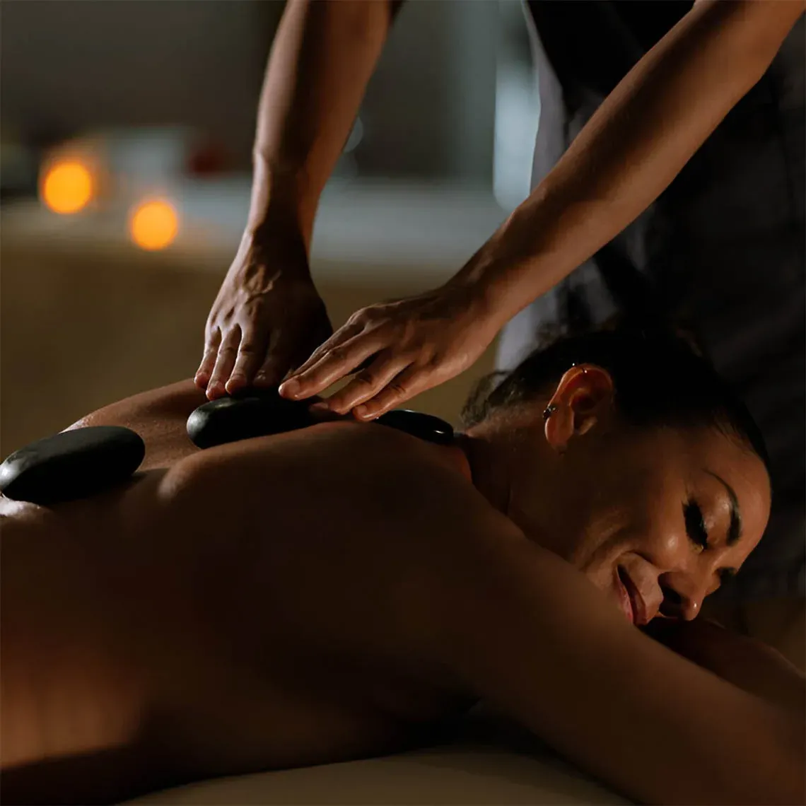 The Fives Corpo: Hot stone massage for ultimate relaxation at our hotels.