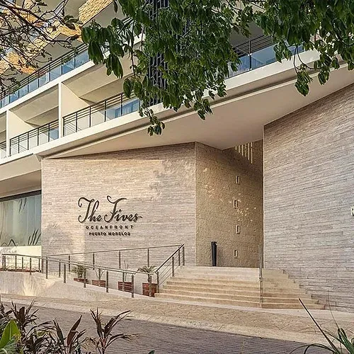 Modern facade of The Fives Oceanfront Puerto Morelos with main entrance.