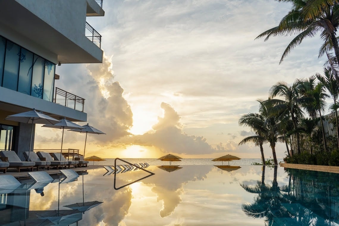 a large room with tables and chairs and a bar