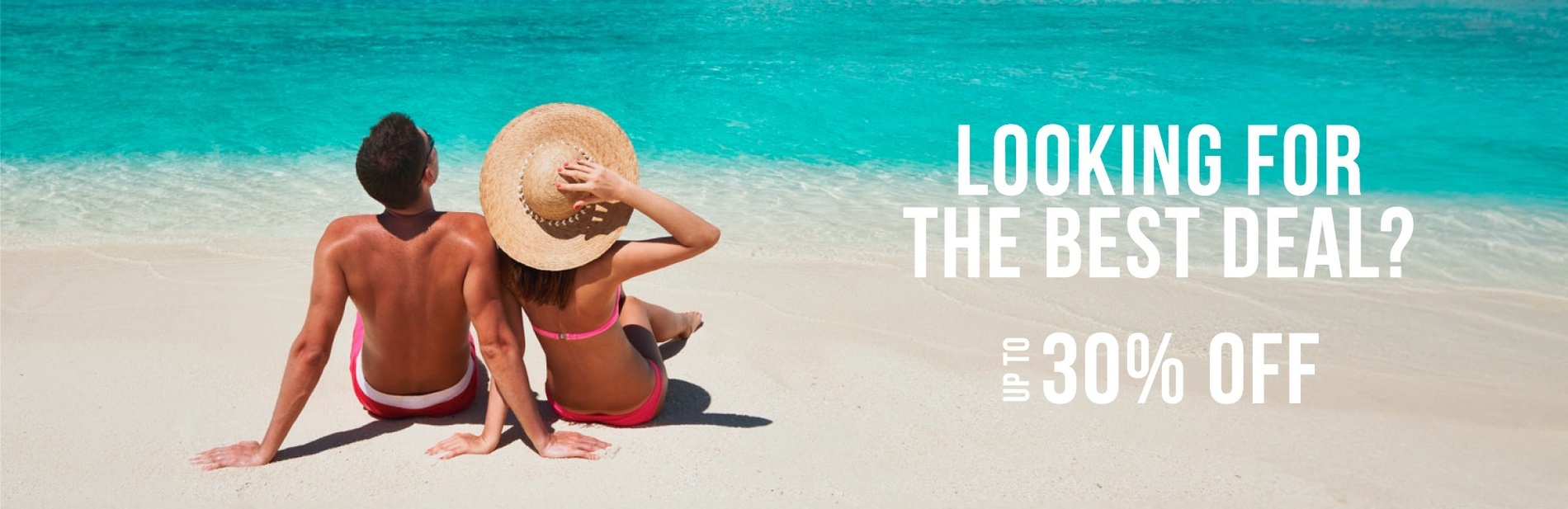 Couple relaxing on an oceanfront beach in Puerto Morelos