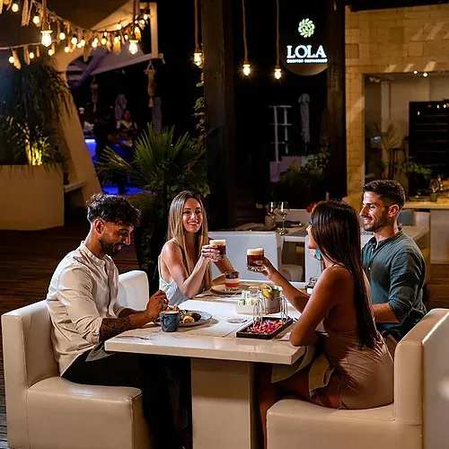 Couple enjoying dinner at The Fives, a romantic ambiance.