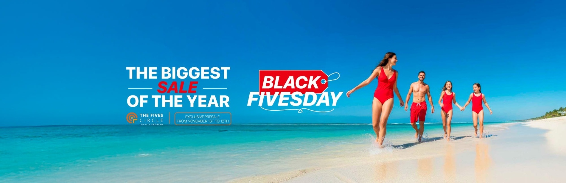 a man and woman standing on a balcony overlooking a swimming pool