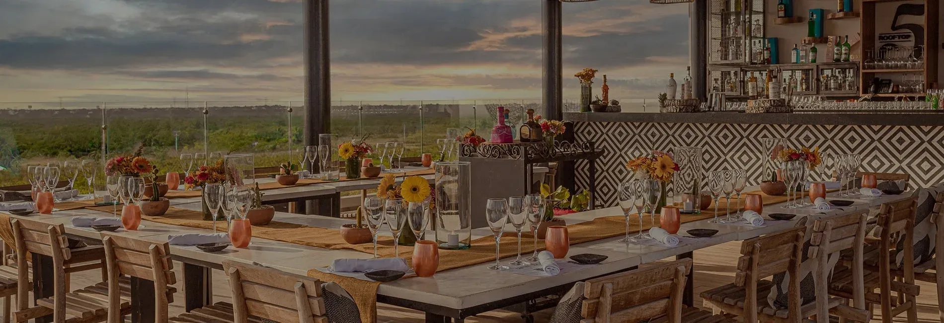 Celebrate your event | The Fives Hotels & Residences rooftop dining setting.