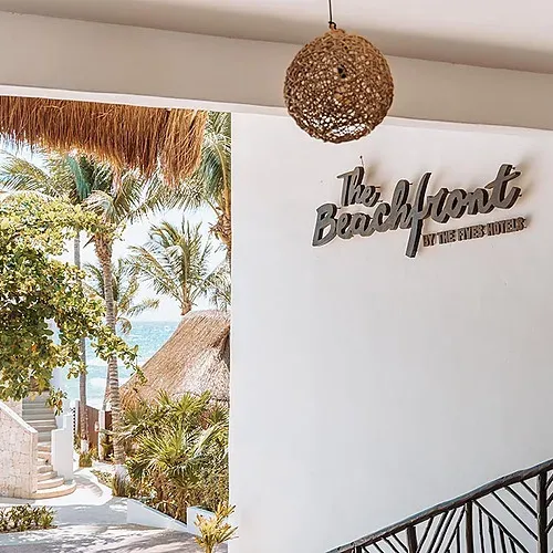 a white wall with the words the beachfront on it