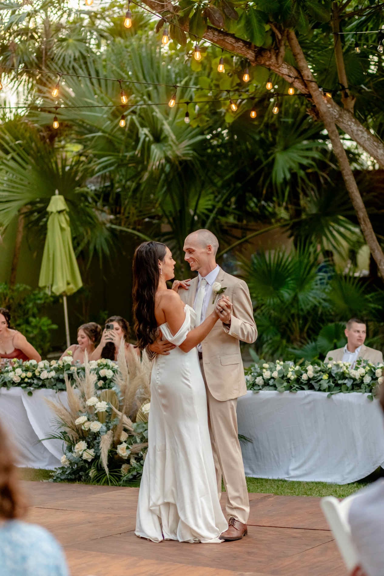 Bride and groom in a tropical garden wedding setting in Riviera Maya