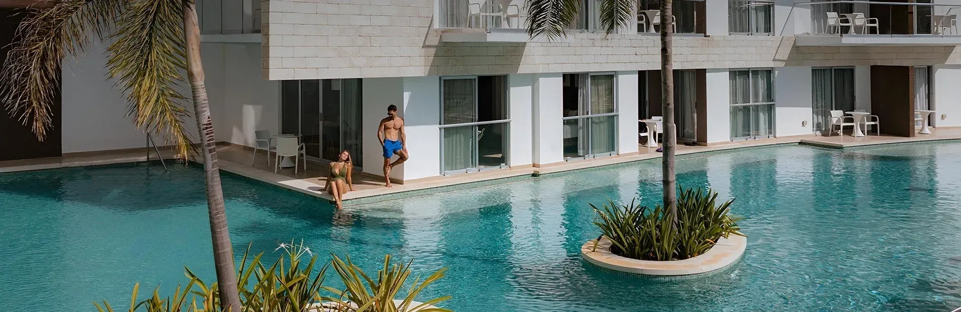 Couple by a private pool, book now for web booking discount | The Fives Hotels official website.