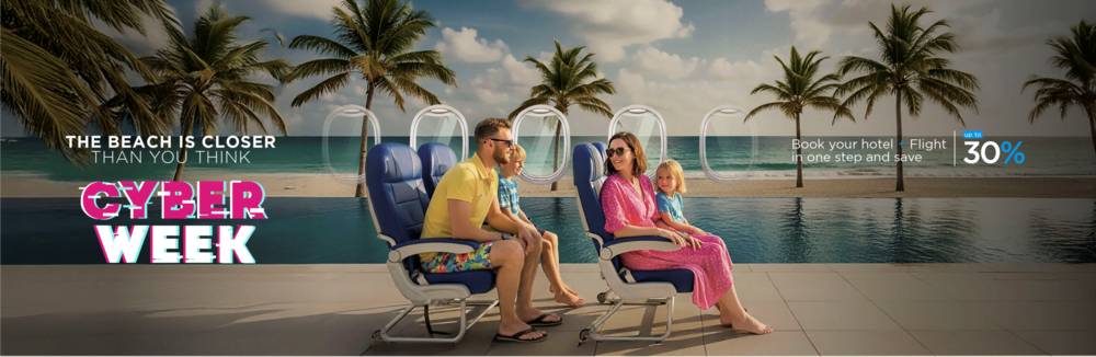 a man and woman standing on a balcony overlooking a swimming pool