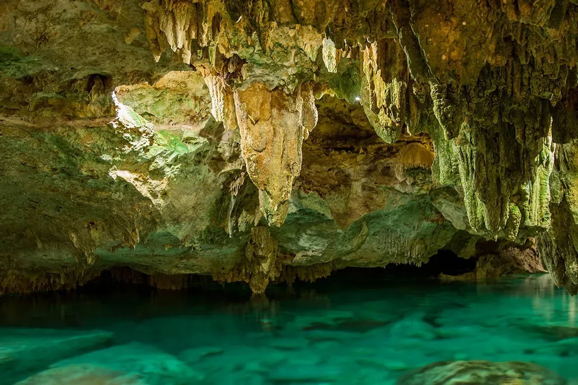 Crystal clear waters and rock formations at The Fives Corpo.