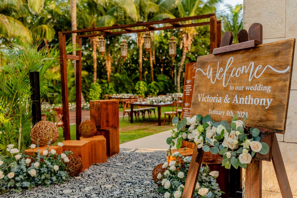 Garden wedding reception with tables and lights in Riviera Maya