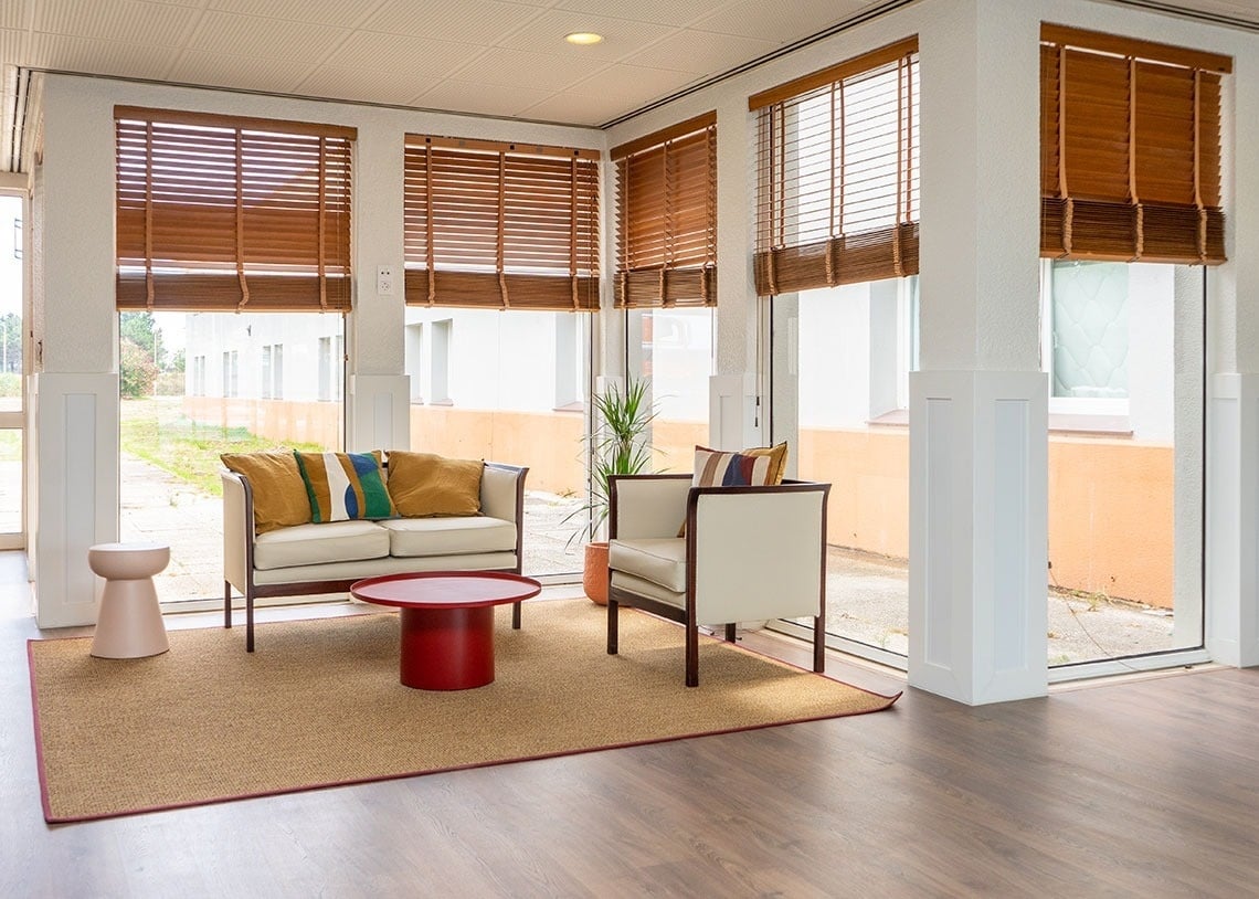 a living room with a couch and two chairs