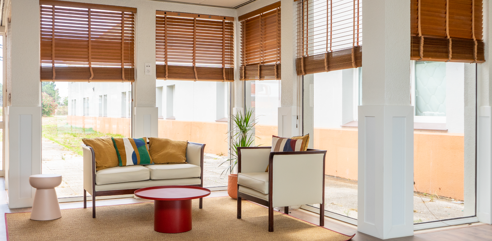 a living room with a couch and two chairs