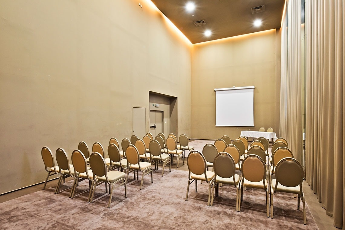Chairs set up for a meeting at Golden Tulip Sao Joao da Madeira | Official website