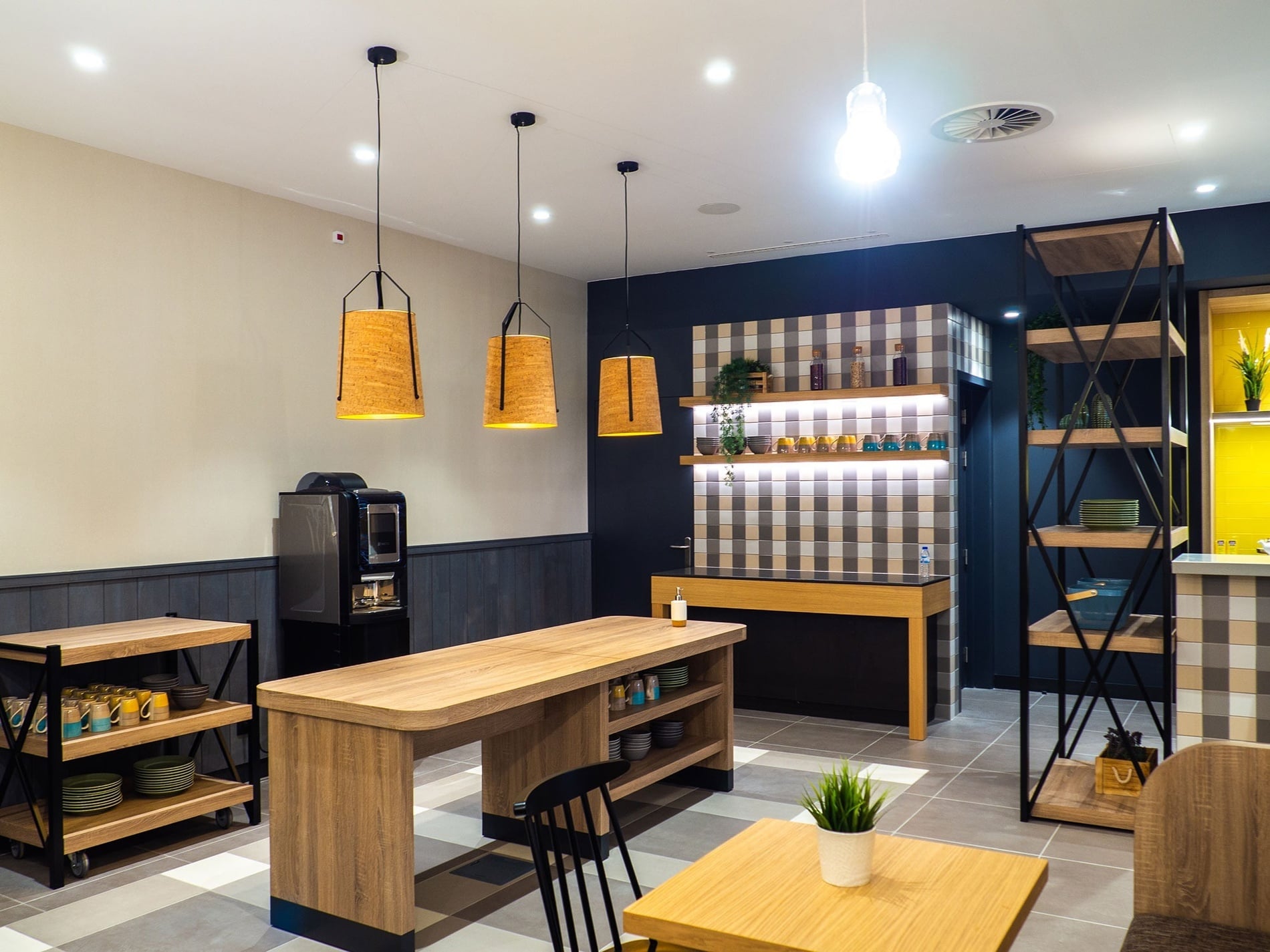 Modern breakfast area at Flag Hotel Caldas da Rainha with wood accents and stylish lighting.