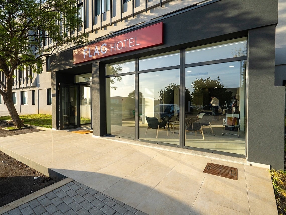 Flag Hotel Lisbon Sintra: Modern entrance with large glass windows and signage.