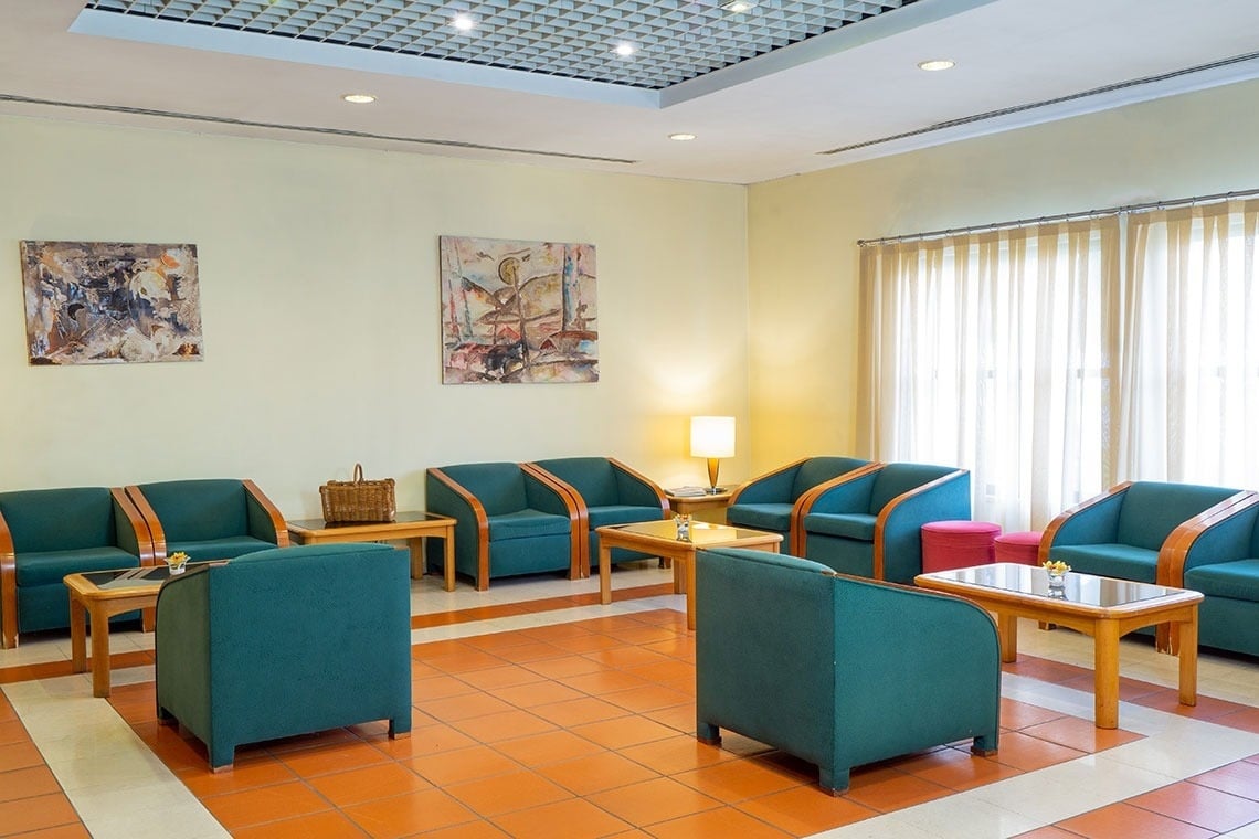 Comfortable lobby seating at Flag Hotel Guimarães Fafe, perfect for relaxing.