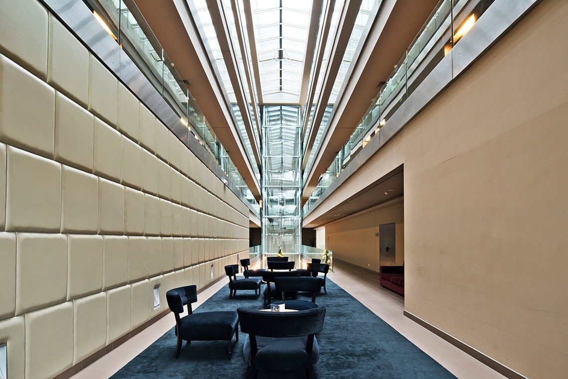 Luxurious hotel lobby with plush seating. Golden Tulip Sao Joao da Madeira | Official website.
