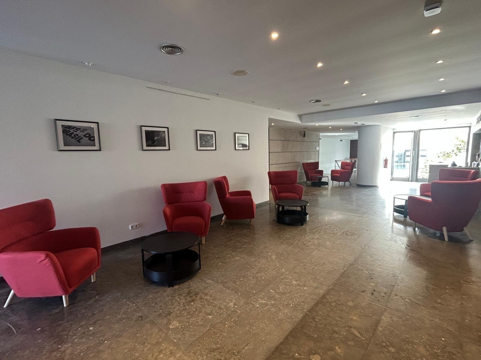 a dining room with tables and chairs and a bar