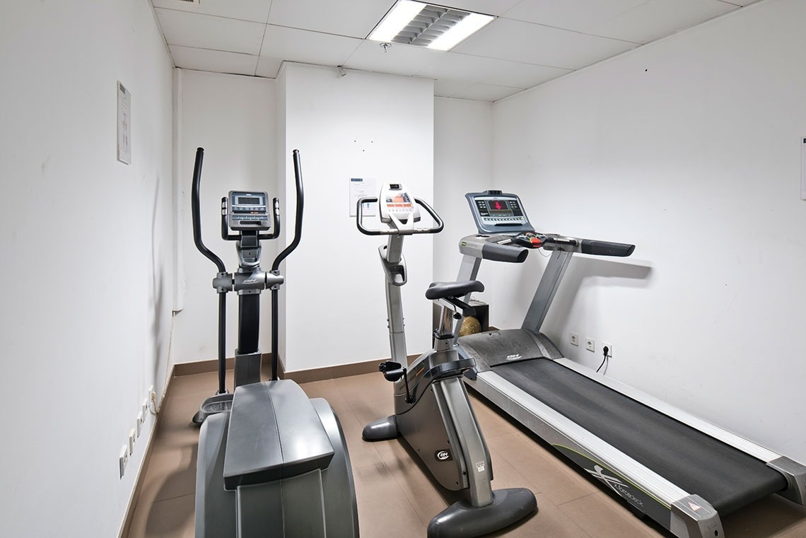 Gym at Golden Tulip Sao Joao da Madeira | Official website: Treadmill, elliptical, and bike.