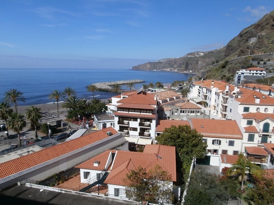 an aerial view of a small town near the ocean