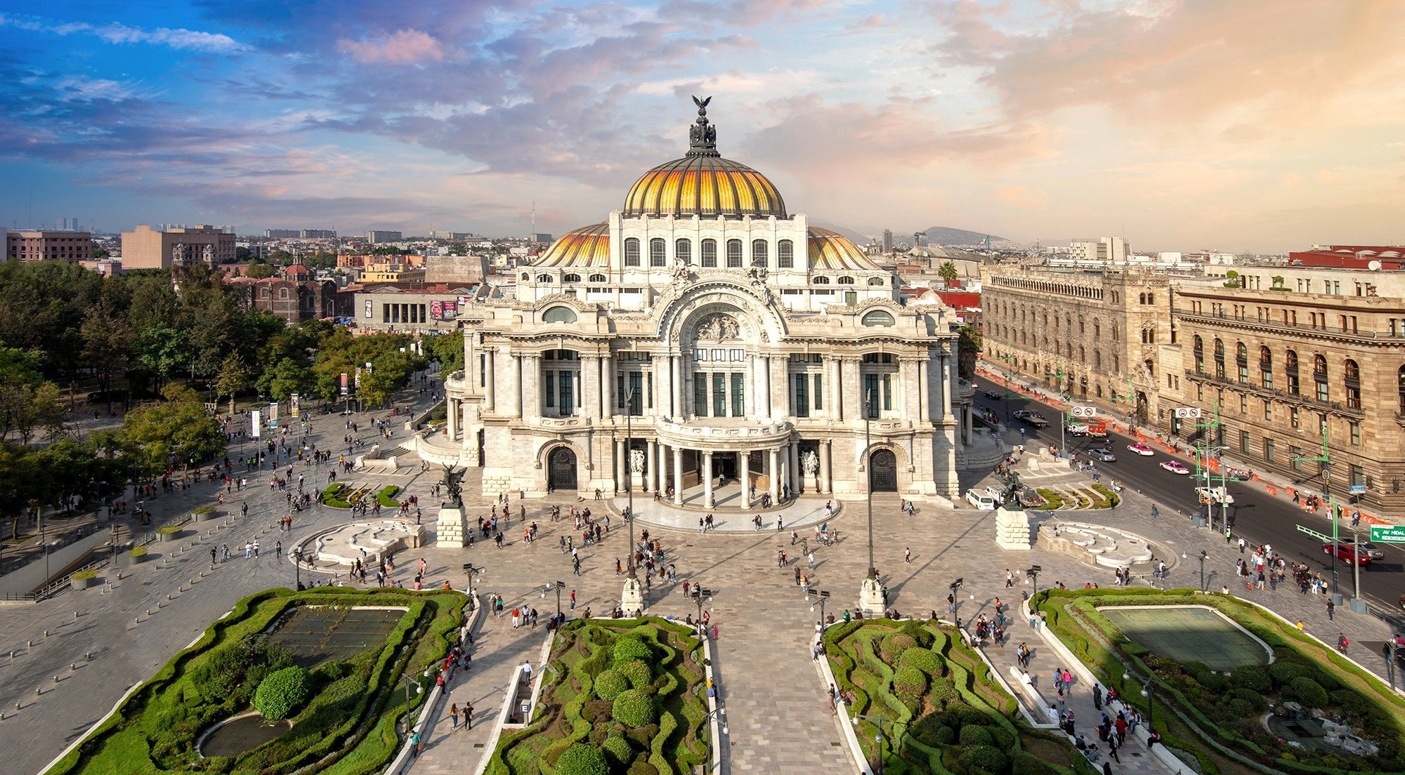 a large white building with a gold dome on top