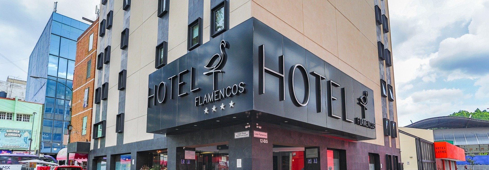 a hotel with flamencos written on the side of it