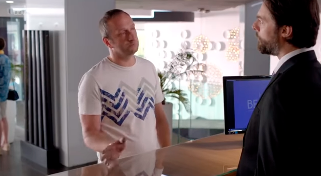 two men are standing in front of a computer screen that says bf
