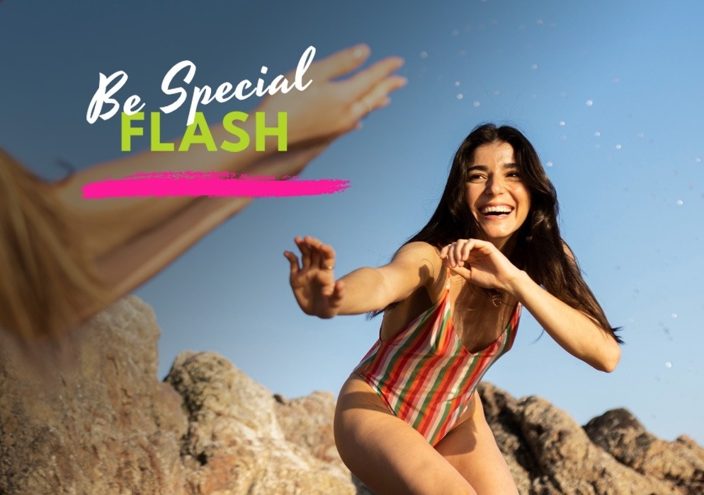 a woman in a striped swimsuit is reaching out to another woman with the words be special flash behind her