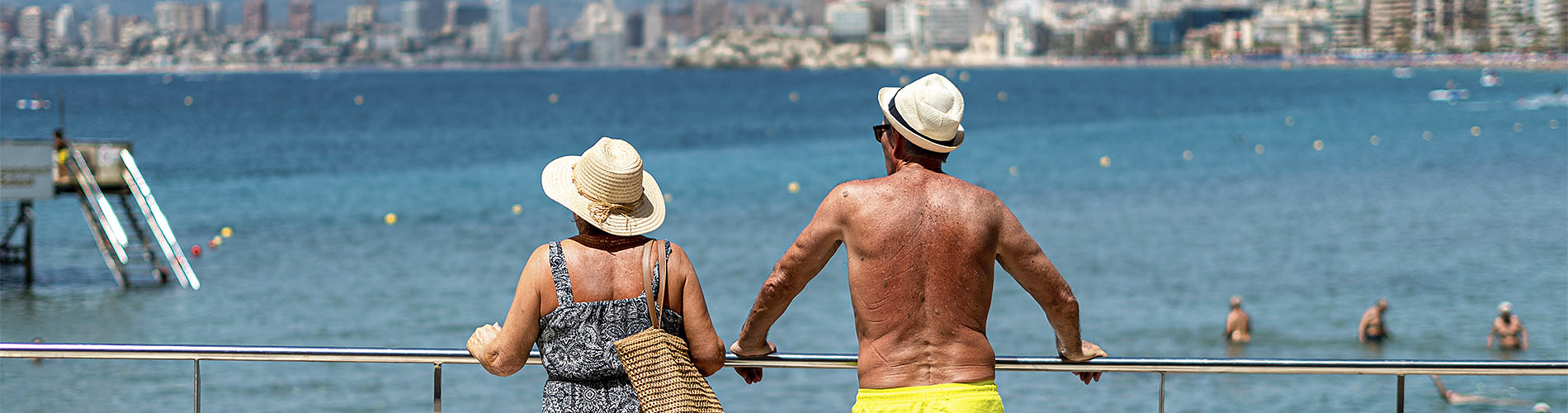 Couple on balcony overlooking beach city skyline Flash