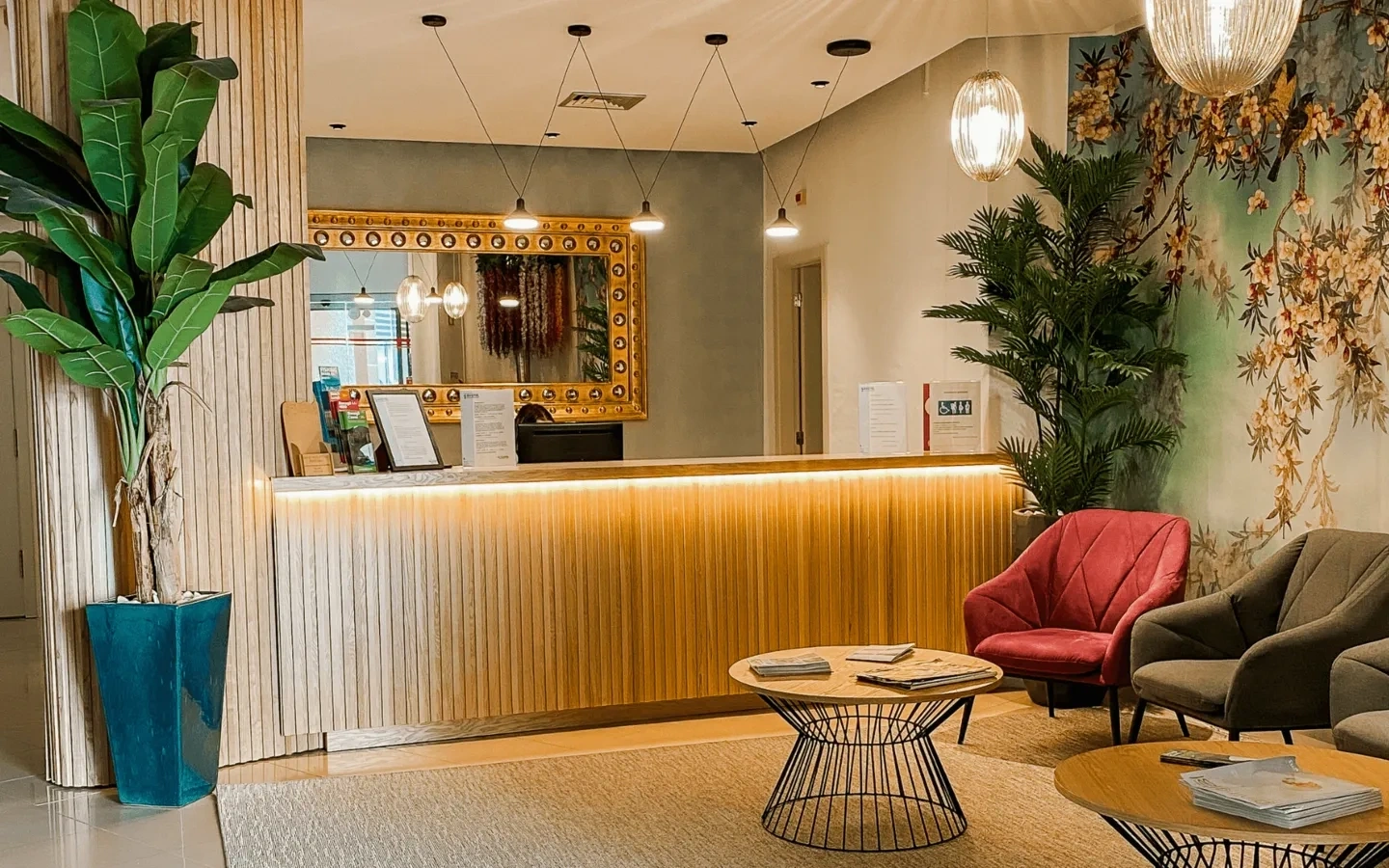 a hotel reception area with a table and chairs