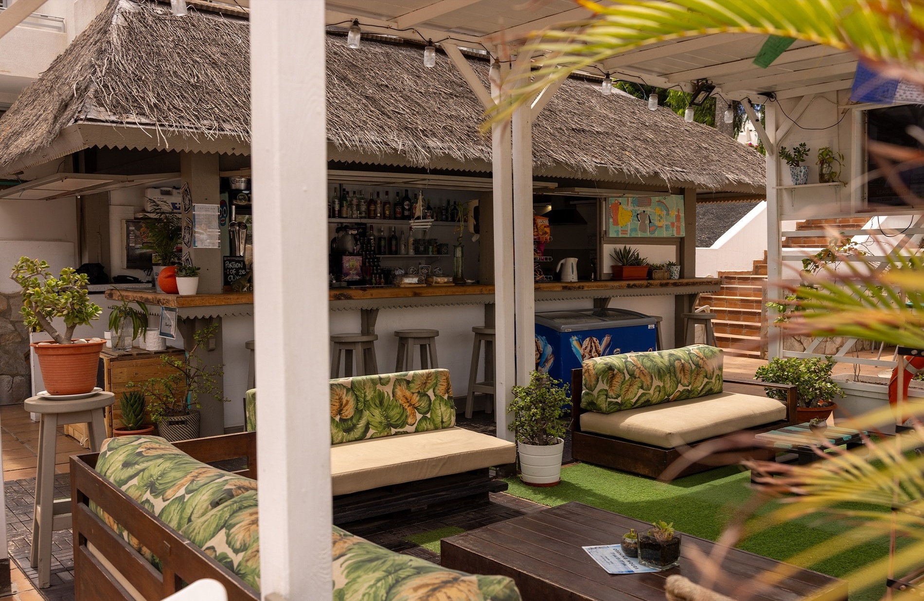 a large body of water with a sandy beach in the background