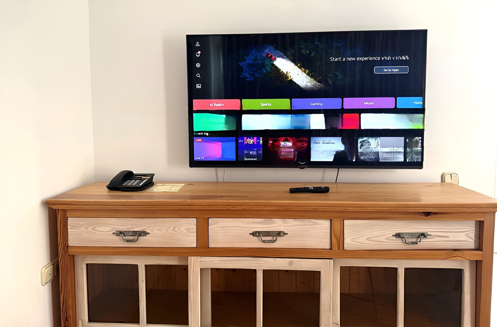a flat screen tv shows a screen that says start a new experience with netflix