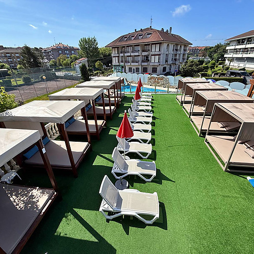 Gala Noja poolside cabanas and lounge chairs offer a luxurious outdoor experience.
