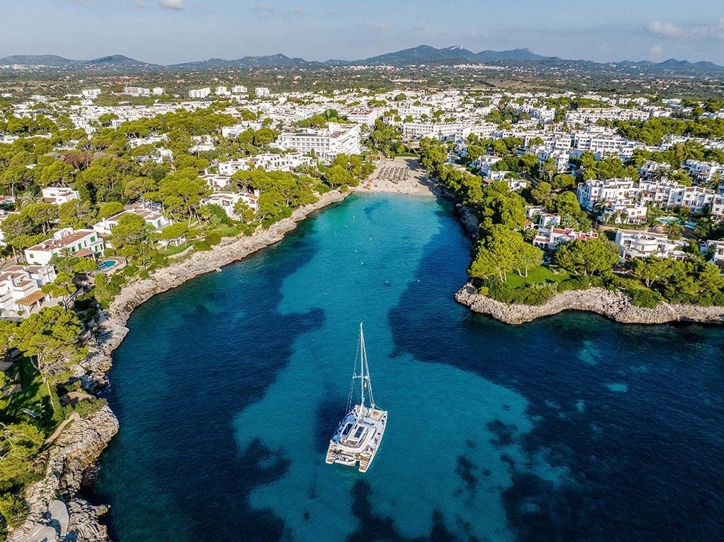 an aerial view of a bay with a boat in it