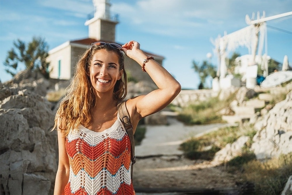 a dining room with tables and chairs and a candle on the table