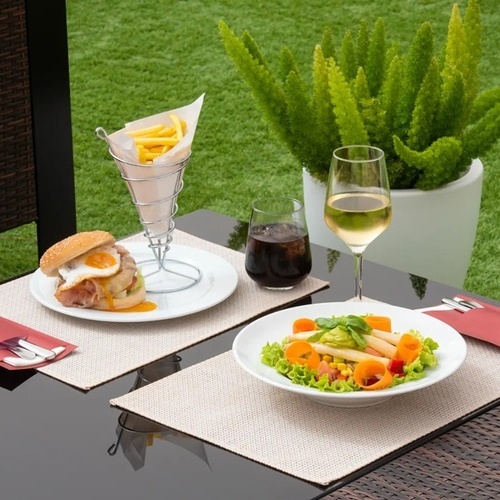 a table with a plate of food and a glass of wine