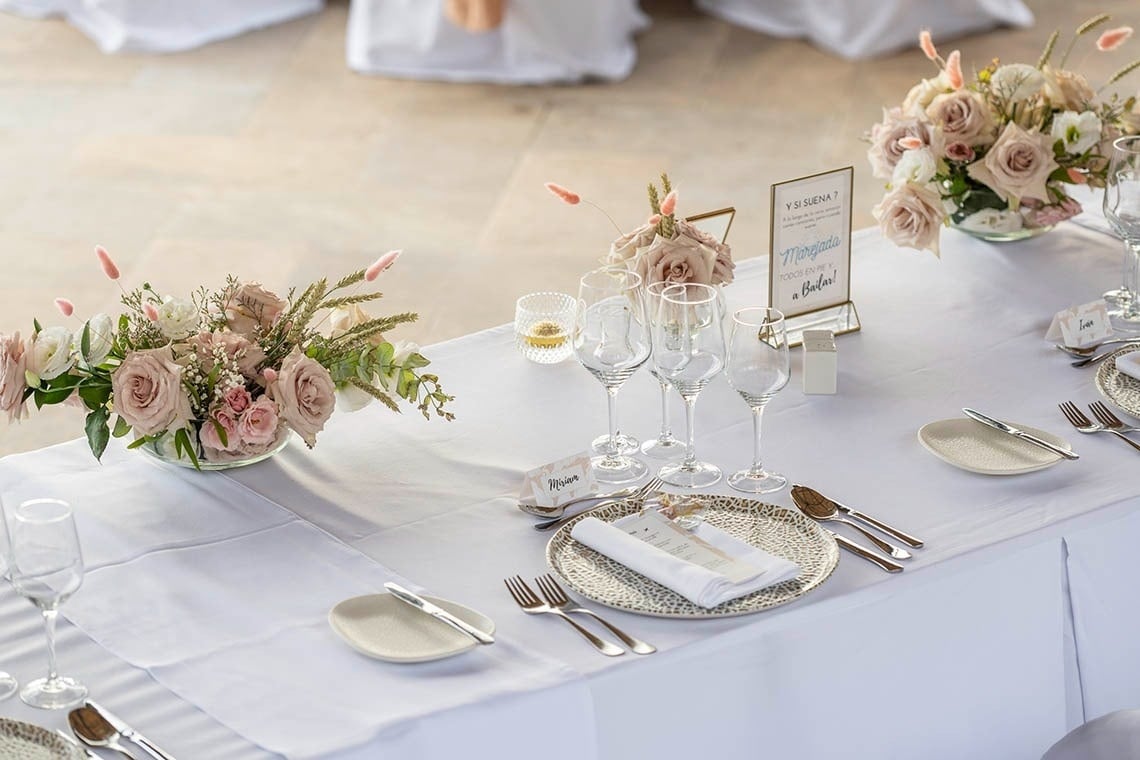 a man stands on a rocky beach near the ocean
