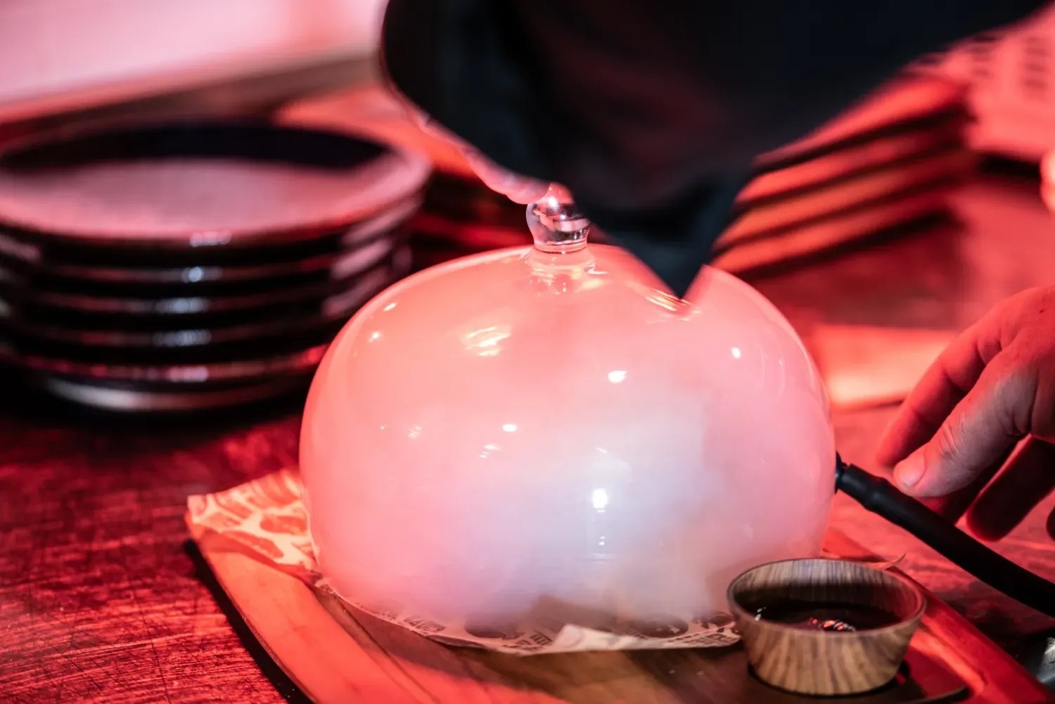 a glass dome with smoke coming out of it