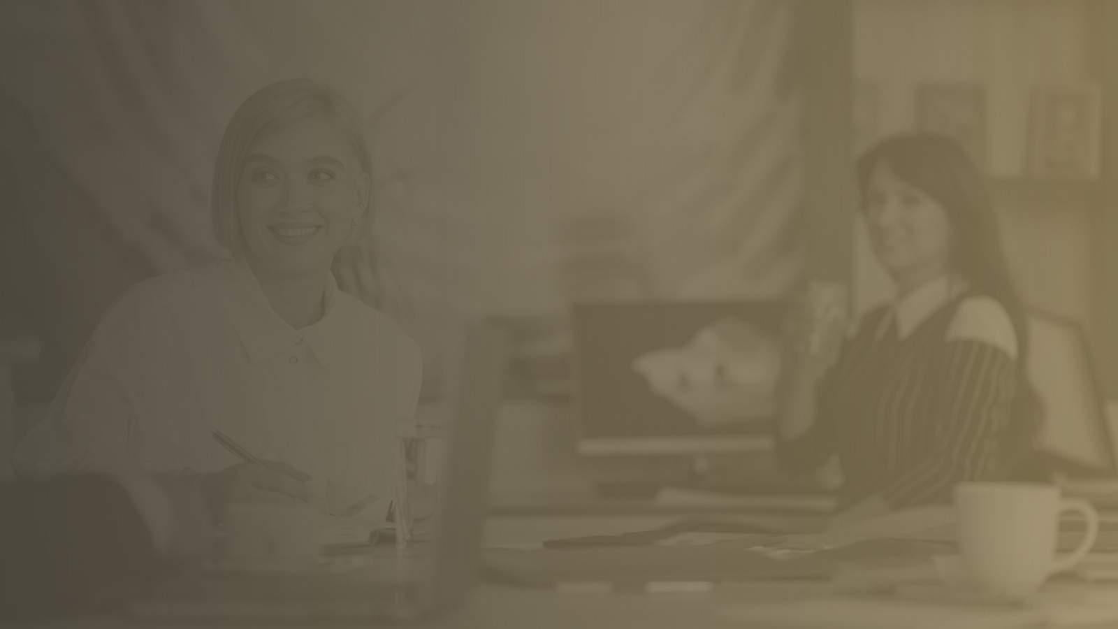 two men are looking at a laptop computer together