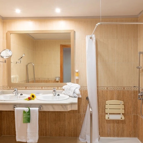 a bathroom with two sinks and a shower curtain
