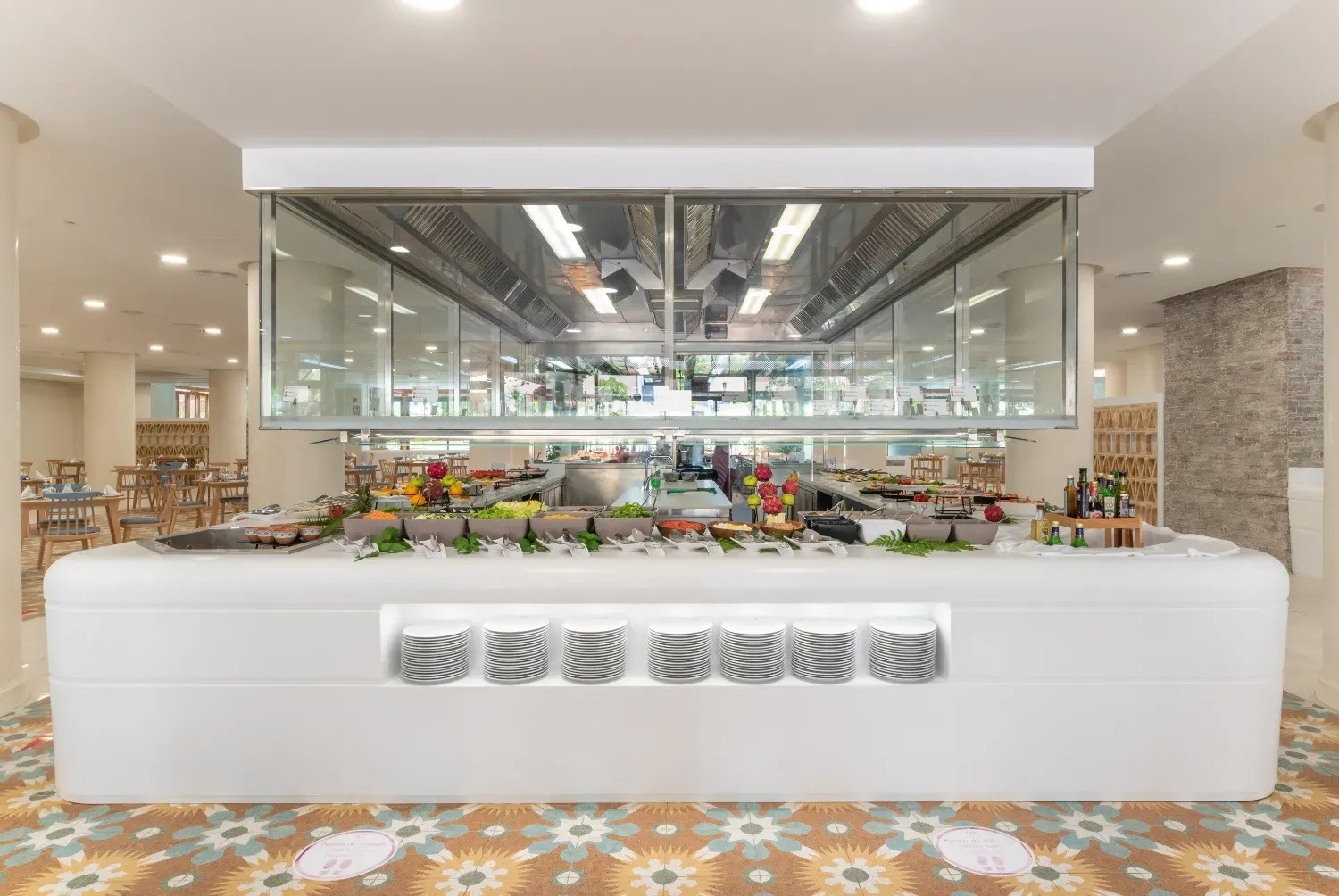 a buffet line in a restaurant with plates on it