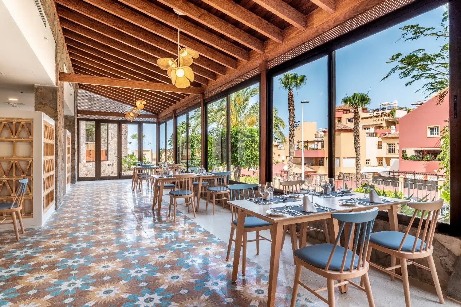 a restaurant with tables and chairs and a large window