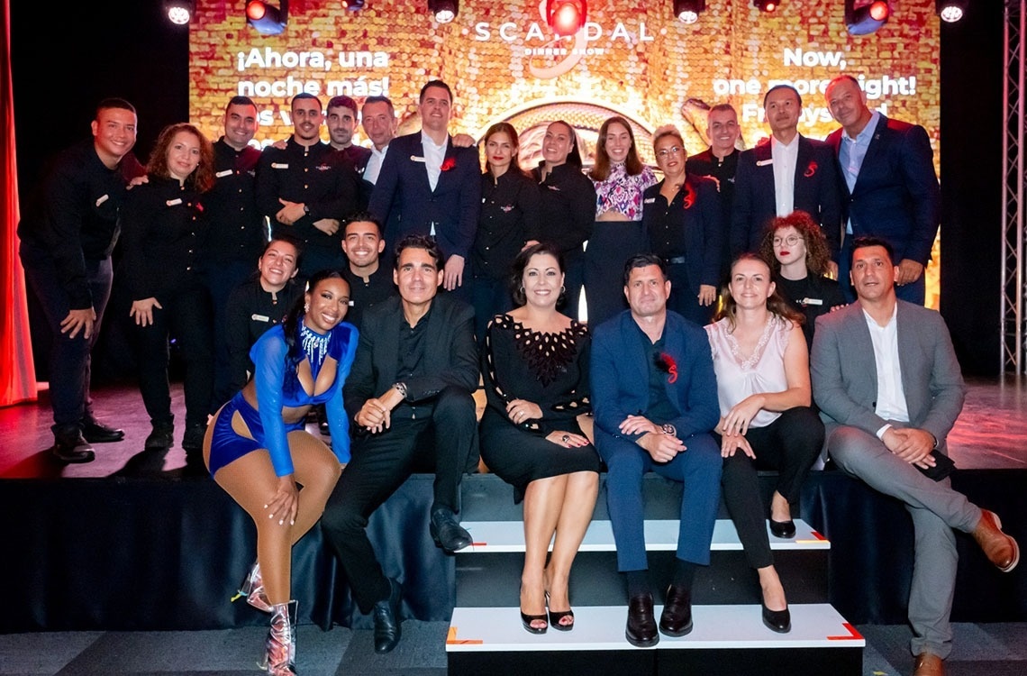 a group of people holding checks that say green stay