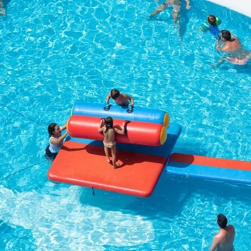a group of people are playing in a swimming pool