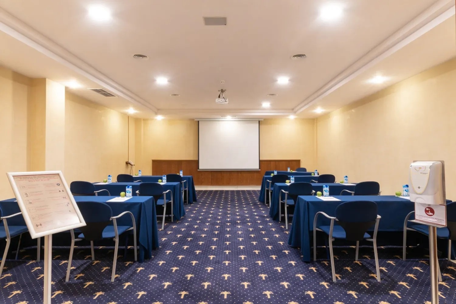 a man stands on a rocky beach near the ocean