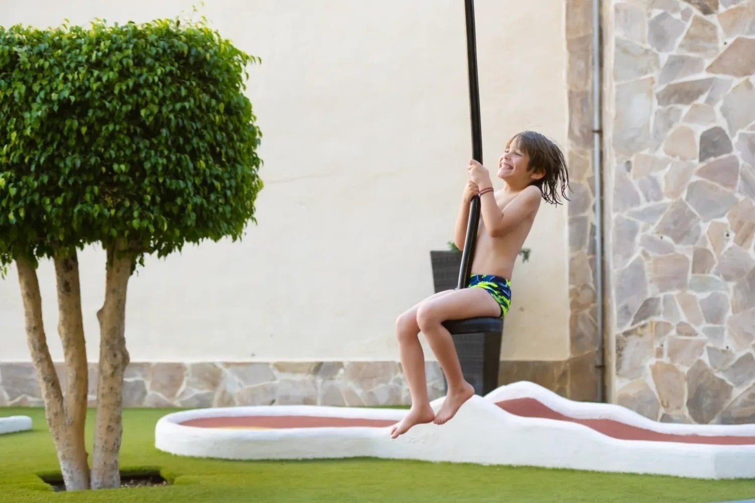 a man stands on a rocky beach near the ocean